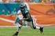 MIAMI GARDENS, FL - DECEMBER 11: Michael Vick #7 of the Philadelphia Eagles scrambles during a game against the Miami Dolphins at Sun Life Stadium on December 11, 2011 in Miami Gardens, Florida. (Photo by Mike Ehrmann/Getty Images)