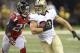 Sep 8, 2013; New Orleans, LA, USA; New Orleans Saints tight end Jimmy Graham (80) carries the ball on a reception against Atlanta Falcons free safety Thomas DeCoud (28) during the second quarter at the Mercedes-Benz Superdome. Mandatory Credit: John David Mercer-USA TODAY Sports