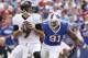 Sep 29, 2013; Orchard Park, NY, USA; Baltimore Ravens quarterback Joe Flacco (5) drops back to pass as Buffalo Bills outside linebacker Manny Lawson (91) rushes during the second half at Ralph Wilson Stadium. The Bills won 23-20. Mandatory Credit: Kevin Hoffman-USA TODAY Sports