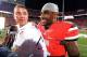 COLUMBUS, OH - SEPTEMBER 28: Quarterback Braxton Miller #5 of the Ohio State Buckeyes sneaks up on Head Coach Urban Meyer of the Ohio State Buckeyes while Meyer is being interviewed for television after the Buckeyes defeated the Wisconsin Badgers 31-24 at Ohio Stadium on September 28, 2013 in Columbus, Ohio. (Photo by Jamie Sabau/Getty Images)