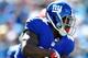 CHARLOTTE, NC - SEPTEMBER 22: David Wilson #22 of the New York Giants runs against the Carolina Panthers during play at Bank of America Stadium on September 22, 2013 in Charlotte, North Carolina. The Panthers won 38-0. (Photo by Grant Halverson/Getty Images)