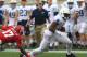 Oct 5, 2013; Bloomington, IN, USA; Penn State Nittany Lions wide receiver Allen Robinson (8) avoids a tackle and runs for a touchdown against the Indiana Hoosiers at Memorial Stadium. Mandatory Credit: Pat Lovell-USA TODAY Sports