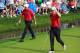 Oct 5, 2013; Dublin, OH, USA; Phil Mickelson and Keegan Bradley walk off the 9th green during the third round of the Presidents Cup at Muirfield Village Golf Club. Mandatory Credit: Allan Henry-USA TODAY Sports