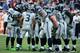 HOUSTON, TX - SEPTEMBER 29: Russell Wilson #3 of the Seattle Seahawks calls a play in the huddle against the Houston Texans at Reliant Stadium on September 29, 2013 in Houston, Texas. (Photo by Scott Halleran/Getty Images)