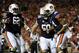 Oct 5, 2013; Auburn, AL, USA; Auburn Tigers quarterback Nick Marshall (14) celebrates his touchdown with offensive linesman Chad Slade (62) and Auburn Tigers defensive tackle Ben Bradley (50) during the second quarter against the Mississippi Rebels at Jordan Hare Stadium. Mandatory Credit: Shanna Lockwood-USA TODAY Sports