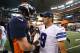 Oct 6, 2013; Arlington, TX, USA; Denver Broncos quarterback Peyton Manning (18) meets with Dallas Cowboys quarterback Tony Romo (9) at the end of the game at AT&T Stadium. The Denver Broncos beat the Dallas Cowboys 51-48. Mandatory Credit: Matthew Emmons-USA TODAY Sports