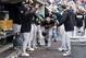 Oct 7, 2013; Detroit, MI, USA; Oakland Athletics first baseman Brandon Moss (37) receives congratulations from teammates after hitting a solo home run in the fifth inning against the Detroit Tigers in game three of the American League divisional series playoff baseball game at Comerica Park. Mandatory Credit: Rick Osentoski-USA TODAY Sports
