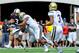 LINCOLN, NE - SEPTEMBER 14: Quarterback Taylor Martinez #3 of the Nebraska Cornhuskers takes a hit from linebacker Anthony Barr #11 of the UCLA Bruins during their game at Memorial Stadium on September 14, 2013 in Lincoln, Nebraska. (Photo by Eric Francis/Getty Images)