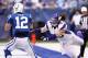 INDIANAPOLIS, IN - SEPTEMBER 16: Andrew Luck #12 of the Indianapolis Colts evades pressure from Brian Robison #96 during the game at Lucas Oil Stadium on September 16, 2012 in Indianapolis, Indiana. The Colts won 23-20. (Photo by Joe Robbins/Getty Images)