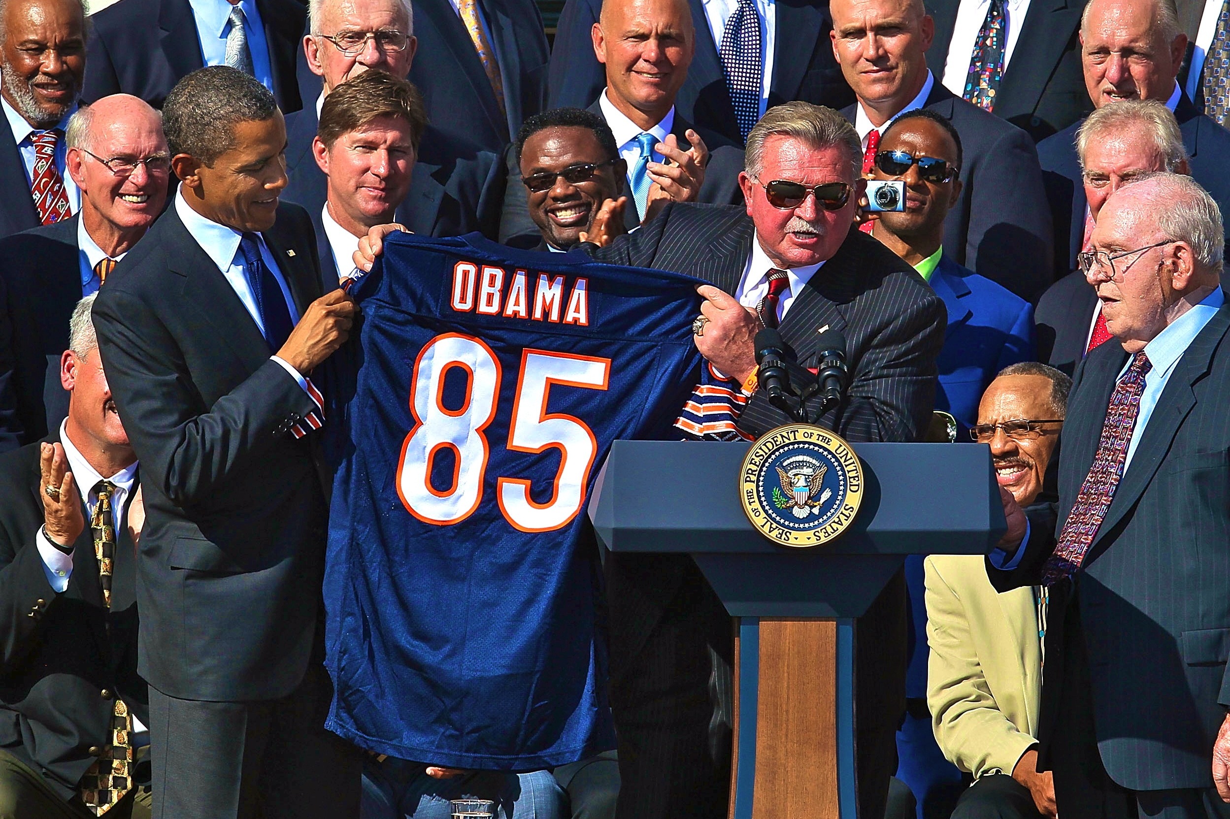 U.S. President Barack Obama accepts a team jersey from head coach Mike  Ditka as Obama welcomes the 1985 Super Bowl Champion Chicago Bears to  celebrate the 25th anniversary of their Super Bowl