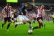 SUNDERLAND, ENGLAND - OCTOBER 05: Robin van Persie of Manchester United is challenged by John O'Shea of Sunderland during the Barclays Premier League match between Sunderland and Manchester United at the Stadium of Light on October 5, 2013 in Sunderland, England. (Photo by Laurence Griffiths/Getty Images)