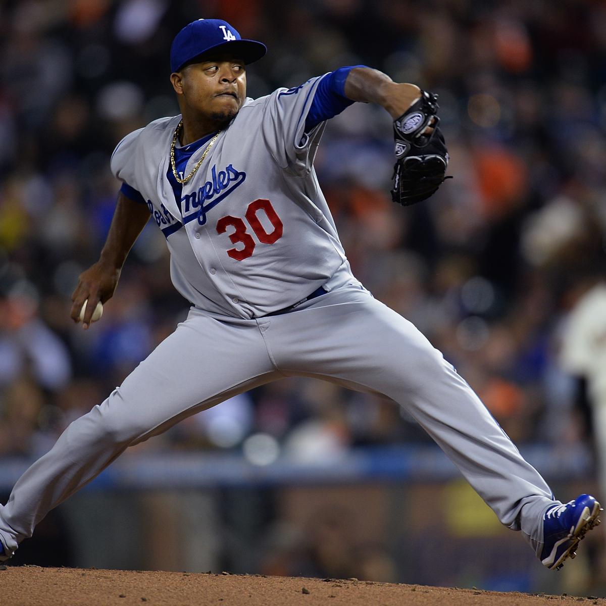 Chicago Cubs players try to catch Los Angeles Dodgers' Paco