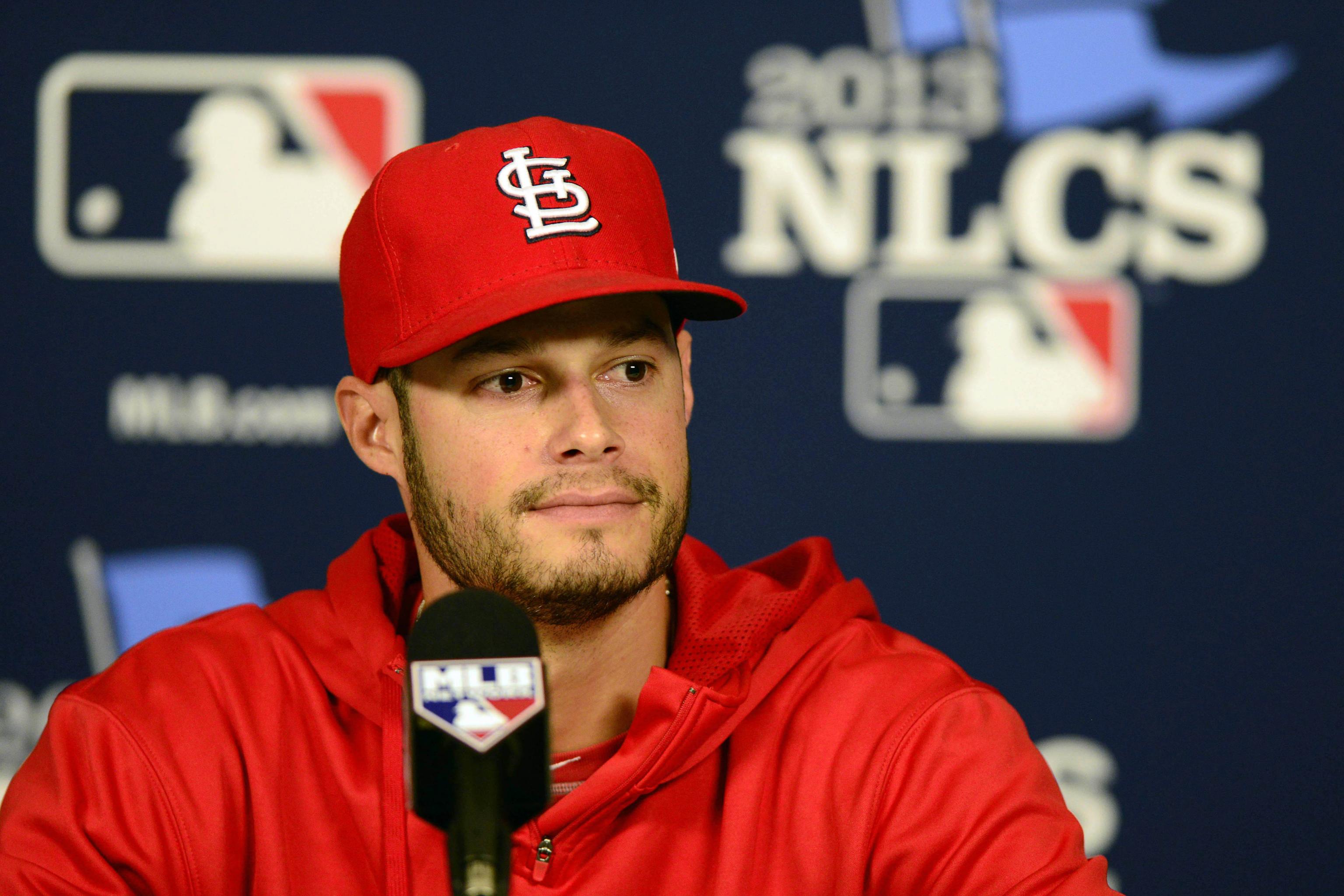 St. Louis Cardinals pitcher Joe Kelly, right, talks with pitcher