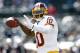 Sep 29, 2013; Oakland, CA, USA; Washington Redskins quarterback Robert Griffin III (10) warms up before the start of the game against the Oakland Raiders at O.co Coliseum. Mandatory Credit: Cary Edmondson-USA TODAY Sports