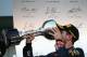 SUZUKA, JAPAN - OCTOBER 13: Sebastian Vettel of Germany and Infiniti Red Bull Racing celebrates on the podium after winning the Japanese Formula One Grand Prix at Suzuka Circuit on October 13, 2013 in Suzuka, Japan. (Photo by Mark Thompson/Getty Images)