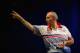 SYDNEY, AUSTRALIA - AUGUST 30: Phil Taylor of England in action during his quarter-final match against Paul Nicholson of England during day two of the Sydney Darts Masters at Luna Park on August 30, 2013 in Sydney, Australia. (Photo by Mark Kolbe/Getty Images)