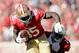 SAN FRANCISCO, CA - OCTOBER 13: Vernon Davis #85 of the San Francisco 49ers is tackled by Jerraud Powers #25 of the Arizona Cardinals after catching the ball at Candlestick Park on October 13, 2013 in San Francisco, California. (Photo by Ezra Shaw/Getty Images)