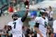 PHILADELPHIA, PA - AUGUST 09: Michael Vick #7 of the Philadelphia Eagles warms up as teamamte Nick Foles #9 stands by before the game against the New England Patriots on August 9, 2013 at Lincoln Financial Field in Philadelphia, Pennslyvania. (Photo by Elsa/Getty Images)