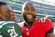 EAST RUTHERFORD, NJ - SEPTEMBER 8: Corner back Ellis Lankster #21 of the New York Jets laughs with former teammate cornerback Darrelle Revis #24 of the Tampa Bay Buccaneers after their game at MetLife Stadium on September 8, 2013 in East Rutherford, New Jersey. The Jets defeated the Bucs 18-17. (Photo by Rich Schultz /Getty Images)