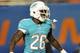 Aug 24, 2013; Miami Gardens, FL, USA; Miami Dolphins running back Lamar Miller (26) reacts during the second quarter against the Tampa Bay Buccaneers at Sun Life Stadium. Mandatory Credit: Steve Mitchell-USA TODAY Sports