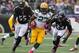 Oct 13, 2013; Baltimore, MD, USA; Green Bay Packers running back Eddie Lacy (27) runs for a long gain past Baltimore Ravens linebacker Terrell Suggs (55) and cornerback Corey Graham (24) at M&T Bank Stadium. Mandatory Credit: Mitch Stringer-USA TODAY Sports