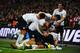 LONDON, ENGLAND - OCTOBER 15: Steven Gerrard of England (obscured) celebrates with team mates as he scores their second goal during the FIFA 2014 World Cup Qualifying Group H match between England and Poland at Wembley Stadium on October 15, 2013 in London, England. (Photo by Laurence Griffiths/Getty Images)