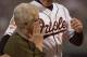6 Oct 2001: Cal Ripken #8 of the Baltimore Orioles escorts his mother Vi Ripken across the field as he his honored prior to his 3001st and final game as the Orioles host the Boston Red Sox at Oriole Park at Camden Yards in Baltimore, Maryland. <<<DIGITAL IMAGE>> Mandatory Credit: Doug Pensinger/ALLSPORT