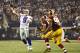Tony Romo throws a pass against the Redskins.