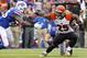 Oct 13, 2013; Orchard Park, NY, USA; Cincinnati Bengals running back Giovani Bernard (25, right) runs against Buffalo Bills strong safety Da'Norris Searcy (25) during the first half at Ralph Wilson Stadium. Mandatory Credit: Timothy T. Ludwig-USA TODAY Sports
