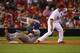 ST. LOUIS, MO - AUGUST 8: Yasiel Puig #66 of the Los Angeles Dodgers slides in to third base for a triple against David Freese #23 of the St. Louis Cardinals in the ninth inning at Busch Stadium on August 8, 2013 in St. Louis, Missouri. The Dodgers beat the Cardinals 5-1. (Photo by Dilip Vishwanat/Getty Images)