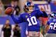 EAST RUTHERFORD, NJ - DECEMBER 04: Eli Manning #10 of the New York Giants throws a 67-yard touchdown in the first quarter to Travis Beckum #47 against the Green Bay Packers at MetLife Stadium on December 4, 2011 in East Rutherford, New Jersey. (Photo by Chris Trotman/Getty Images)