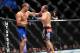 Dec 29, 2012; Las Vegas, NV, USA; Junior Dos Santos (left) and Cain Velasquez (right) exchange strikes during UFC 155 at the MGM Grand Garden Arena. Mandatory Credit: Gary A. Vasquez-USA TODAY Sports
