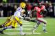 I'Tavius Mathers runs away from LSU tacklers late in the fourth quarter.