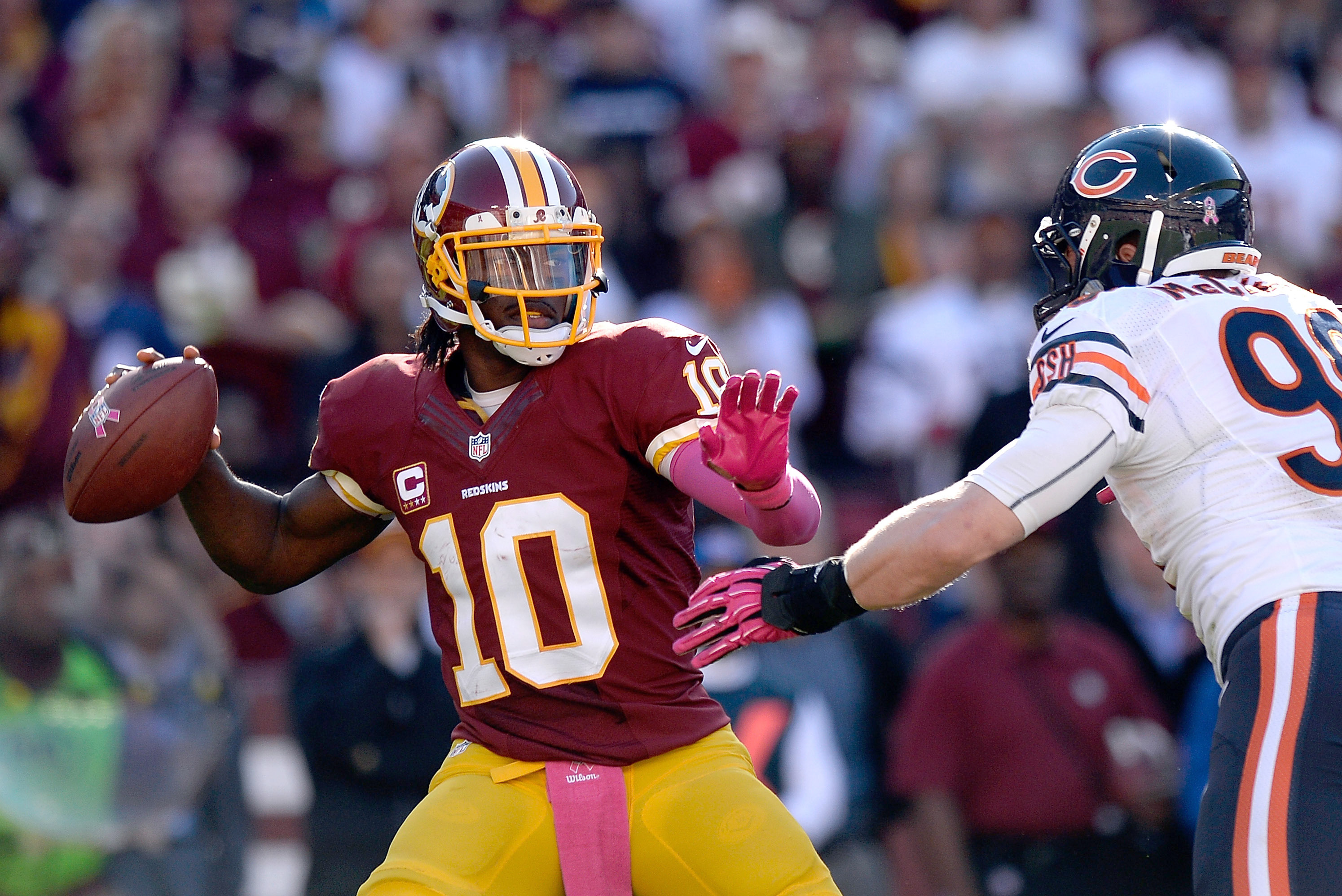 Robert Griffin III of the Washington Redskins throws a pass against News  Photo - Getty Images