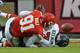 KANSAS CITY, MO - OCTOBER 20: Quarterback Case Keenum #7 of the Houston Texans fumbles as he is sacked by linebacker Tamba Hali #91 of the Kansas City Chiefs during the fourth quarter on October 20, 2013 at Arrowhead Stadium in Kansas City, Missouri. (Photo by Peter Aiken/Getty Images)