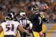 Oct 20, 2013; Pittsburgh, PA, USA; Pittsburgh Steelers quarterback Ben Roethlisberger (7) passes the ball under pressure from the Baltimore Ravens during the fourth quarter at Heinz Field. The Steelers won 19-16. Mandatory Credit: Charles LeClaire-USA TODAY Sports