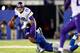 EAST RUTHERFORD, NJ - OCTOBER 21: Quarterback Josh Freeman #12 of the Minnesota Vikings is sacked by defensive end Justin Tuck #91 of the New York Giants during a game at MetLife Stadium on October 21, 2013 in East Rutherford, New Jersey. (Photo by Elsa/Getty Images)