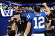 Oct 20, 2013; Indianapolis, IN, USA; Indianapolis Colts quarterback Andrew Luck (12) waves to the crowd as he leaves the field after the game against the Denver Broncos at Lucas Oil Stadium. Mandatory Credit: Ron Chenoy-USA TODAY Sports