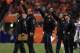 DENVER, CO - SEPTEMBER 23: Head coach Dennis Allen (center) of the Oakland Raiders and his coaching staff lead the Raiders against the Denver Broncos at Sports Authority Field at Mile High on September 23, 2013 in Denver, Colorado. The Broncos defeated the Raiders 37-21. (Photo by Doug Pensinger/Getty Images)