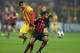MILAN, ITALY - OCTOBER 22: Robinho of AC Milan and Gerard Pique of FC Barcelona (L) compete for the ball during the UEFA Champions League Group H match between AC Milan and Barcelona at Stadio Giuseppe Meazza on October 22, 2013 in Milan, Italy. (Photo by Claudio Villa/Getty Images)