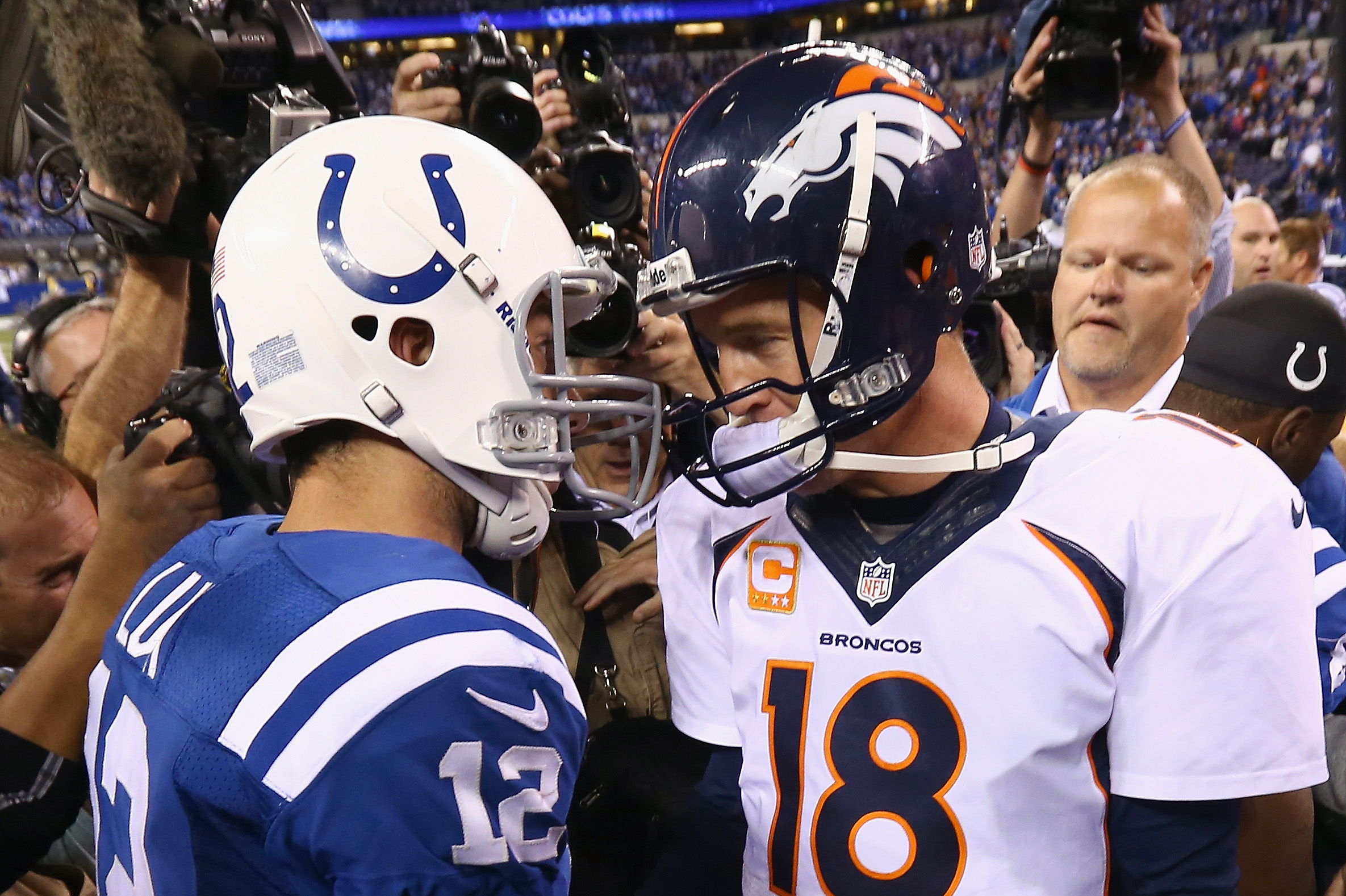 Indianapolis Colts quarterback Andrew Luck (12) greets Denver