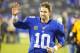 Oct 21, 2013; East Rutherford, NJ, USA; New York Giants quarterback Eli Manning (10) waves to fans leaving the field after victory over Minnesota Vikings at MetLife Stadium. New York Giants defeat the Minnesota Vikings 23-7. Mandatory Credit: Jim O'Connor-USA TODAY Sports