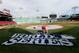 BOSTON, MA - OCTOBER 22: A groundskeeper works on the logo behind home before the start of 2013 World Series Media Day at Fenway Park on October 22, 2013 in Boston, Massachusetts. The Boston Red Sox host the St. Louis Cardinals in Game 1 on October 23, 2013. (Photo by Rob Carr/Getty Images)