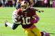 Oct 20, 2013; Landover, MD, USA; Washington Redskins quarterback Robert Griffin III (10) runs with the ball against the Chicago Bears during the first half at FedEX Field. Mandatory Credit: Brad Mills-USA TODAY Sports
