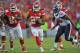 KANSAS CITY, MO - OCTOBER 20: Running back Jamaal Charles #25 of the Kansas City Chiefs rushes past defensive end Tim Jamison #96 of the Houston Texans for a first down during the second half on October 20, 2013 at Arrowhead Stadium in Kansas City, Missouri. Kansas City won 17-16. (Photo by Peter Aiken/Getty Images)
