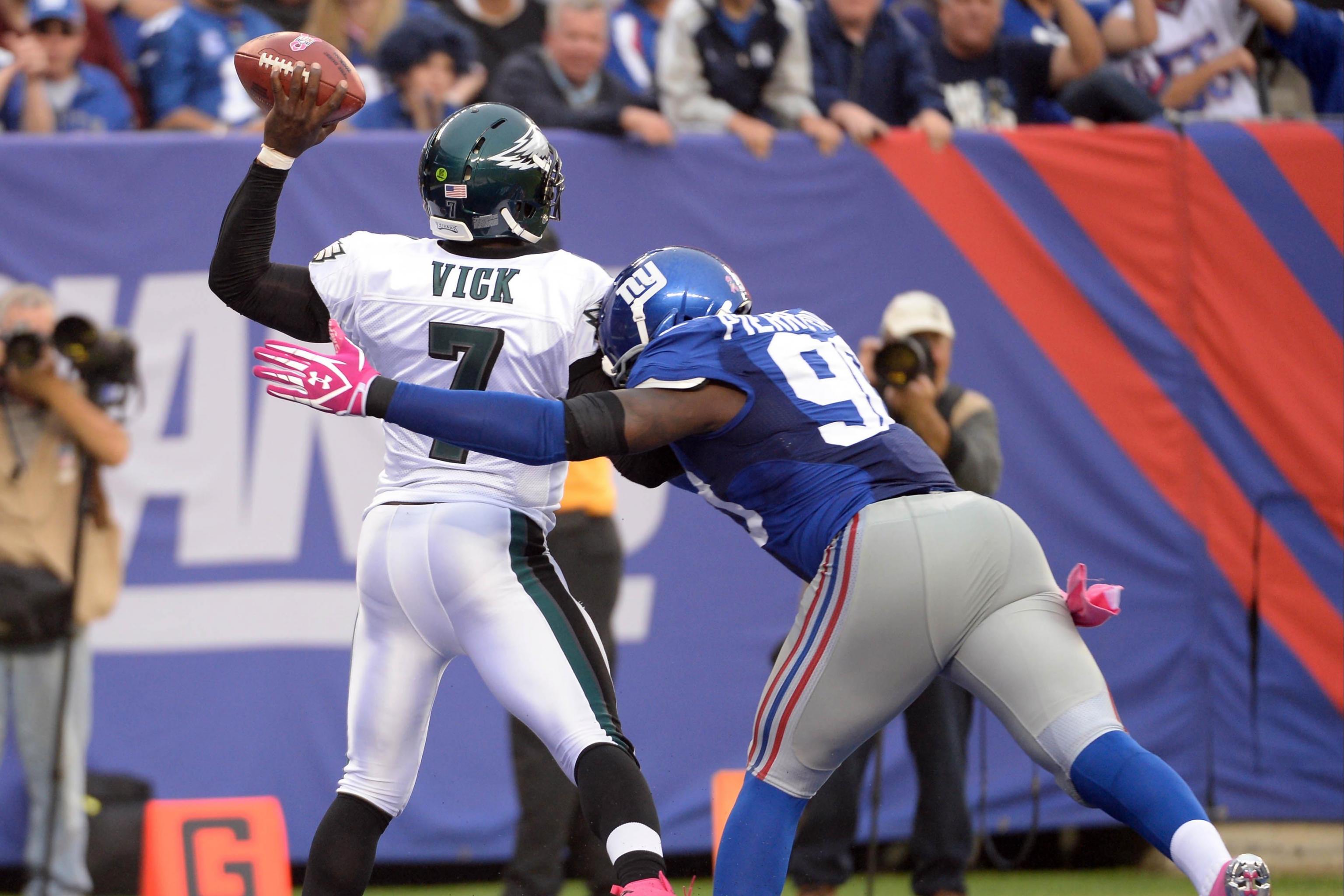 Without Contact, Vick Takes Hit in the Pocket - The New York Times