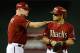 PHOENIX, AZ - AUGUST 14: Gerardo Parra #8 of the Arizona Diamondbacks talks with third base coach Matt Williams #9 while standing on base against the Baltimore Orioles at Chase Field on August 14, 2013 in Phoenix, Arizona. (Photo by Norm Hall/Getty Images)