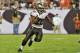 TAMPA, FL - SEPTEMBER 15: Running back Doug Martin #22 of the Tampa Bay Buccaneers runs for a gain against the New Orleans Saints September 15, 2013 at Raymond James Stadium in Tampa, Florida. The Saints won 16 - 14. (Photo by Al Messerschmidt/Getty Images)