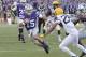 Oct 26, 2013; Manhattan, KS, USA; Kansas State Wildcats quarterback Jake Waters (15) runs the ball against the West Virginia Mountaineers during the second half at Bill Snyder Family Stadium. The Wildcats defeat the Mountaineers 35-12. Mandatory Credit: Jasen Vinlove-USA TODAY Sports