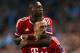 MANCHESTER, ENGLAND - OCTOBER 02: Franck Ribery of Muenchen celebrates scoring the opening goal with David Alaba of Muenchen during the UEFA Champions League Group D match between Manchester City and FC Bayern Muenchen at Etihad Stadium on October 2, 2013 in Manchester, England. (Photo by Julian Finney/Getty Images)